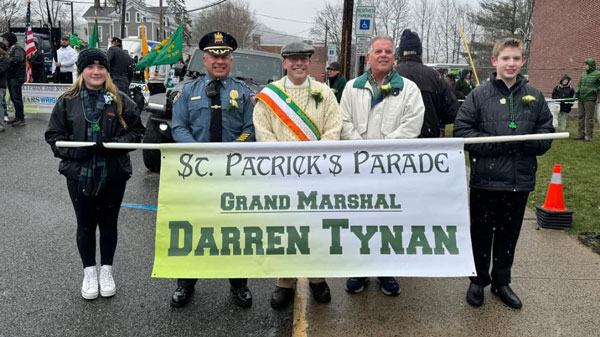 Hackettstown's St. Patrick's Day parade with the Grand Marshal banner.